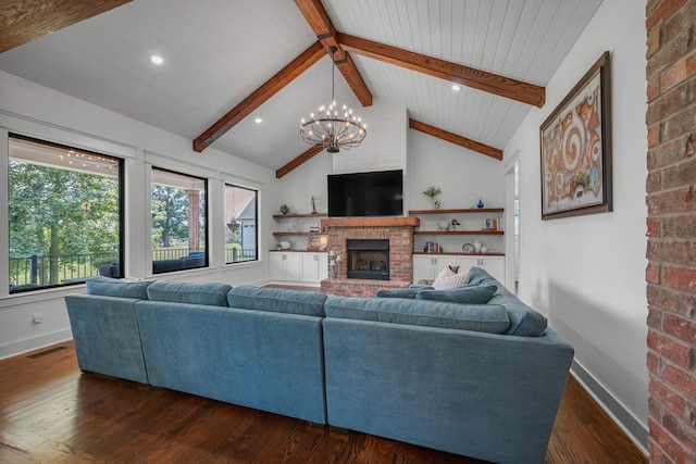 445 Old Pond Ln, Dickson, TN 37055 - living room with a brick fireplace, dark wood-style flooring, healthy amount of natural light, a chandelier, and recessed lighting
