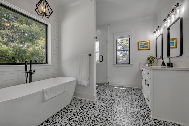 445 Old Pond Ln, Dickson, TN 37055 - bathroom with vanity, a stall shower, a freestanding tub, and tile patterned flooring