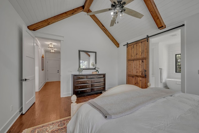 445 Old Pond Ln, Dickson, TN 37055 - bedroom with a barn door, wood finished floors, and a ceiling fan