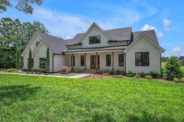 445 Old Pond Ln, Dickson, TN 37055 - modern inspired farmhouse featuring a shingled roof, a porch, a front yard, and board and batten siding