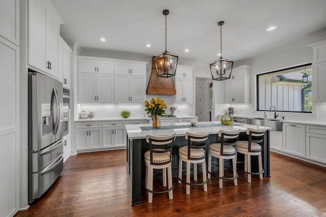 445 Old Pond Ln, Dickson, TN 37055 - kitchen featuring stainless steel fridge with ice dispenser, decorative backsplash, light countertops, white cabinets, and crown molding