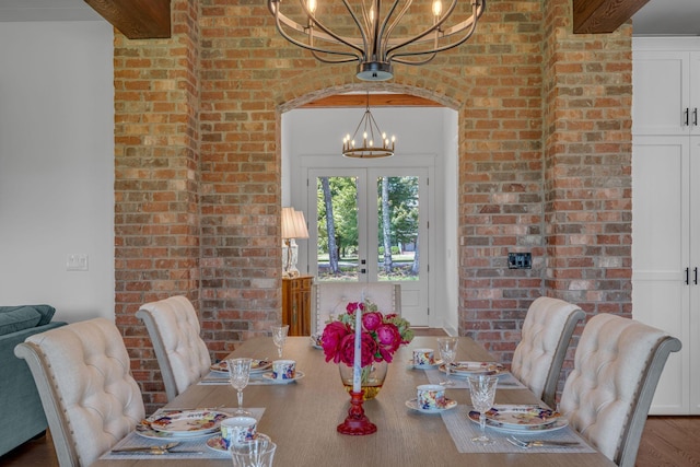 445 Old Pond Ln, Dickson, TN 37055 - dining area with a chandelier, brick wall, wood finished floors, and french doors