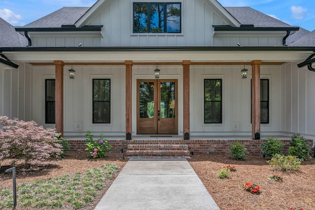 445 Old Pond Ln, Dickson, TN 37055 - entrance to property featuring board and batten siding, a porch, roof with shingles, and french doors