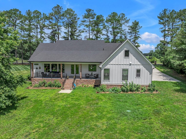 445 Old Pond Ln, Dickson, TN 37055 - modern farmhouse style home with board and batten siding, a front yard, and roof with shingles