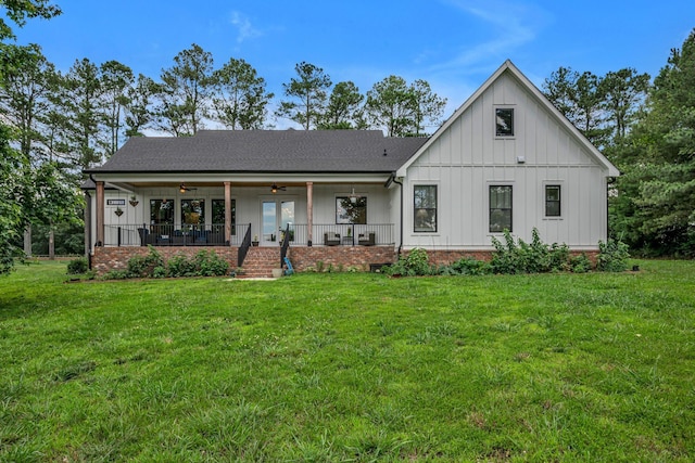 445 Old Pond Ln, Dickson, TN 37055 - modern inspired farmhouse featuring a ceiling fan, a front lawn, board and batten siding, and covered porch