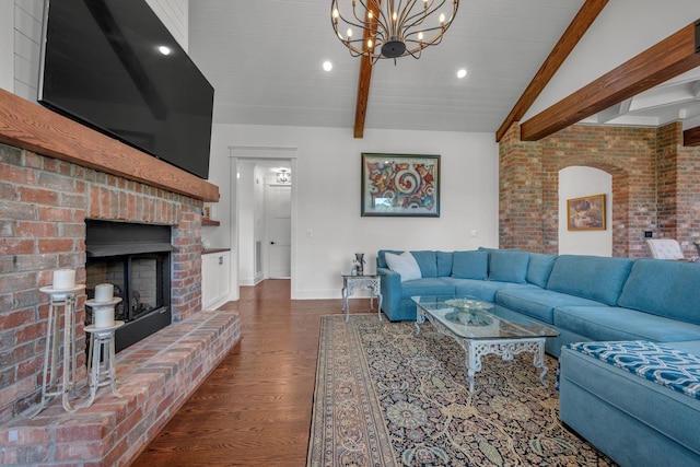 445 Old Pond Ln, Dickson, TN 37055 - living room featuring a fireplace, wood finished floors, a chandelier, brick wall, and recessed lighting
