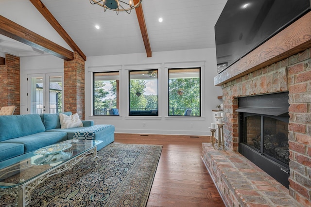 445 Old Pond Ln, Dickson, TN 37055 - living area with plenty of natural light, wood finished floors, a brick fireplace, and recessed lighting
