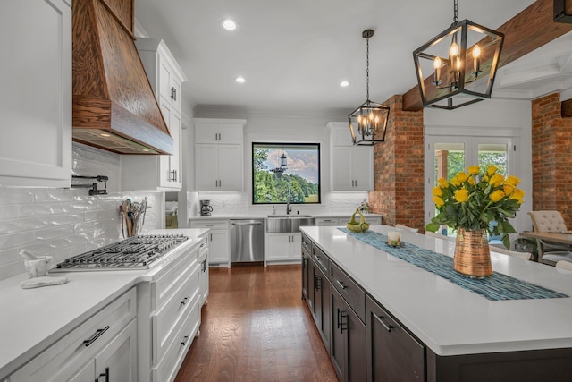 445 Old Pond Ln, Dickson, TN 37055 - kitchen featuring a chandelier, stainless steel appliances, custom range hood, light countertops, and plenty of natural light