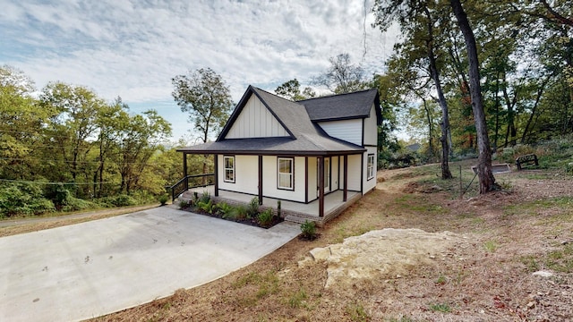 2346 Rhea Branch Rd, Ethridge, TN 38456 - view of front of house featuring covered porch, board and batten siding, and a shingled roof
