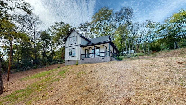 2346 Rhea Branch Rd, Ethridge, TN 38456 - view of front of property with crawl space, board and batten siding, and a porch