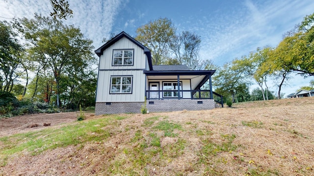 2346 Rhea Branch Rd, Ethridge, TN 38456 - view of front facade with a porch, crawl space, and board and batten siding