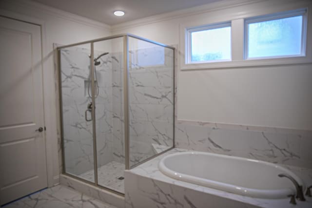 1023 Echelon Dr, Franklin, TN 37064 - bathroom featuring marble finish floors, a bath, a marble finish shower, and crown molding