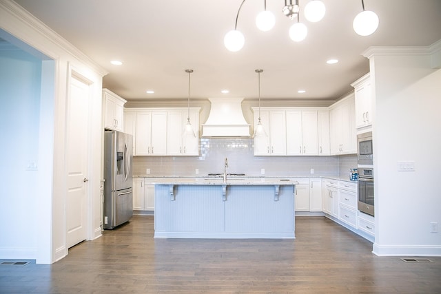 1023 Echelon Dr, Franklin, TN 37064 - kitchen featuring custom exhaust hood, appliances with stainless steel finishes, a kitchen bar, tasteful backsplash, and recessed lighting