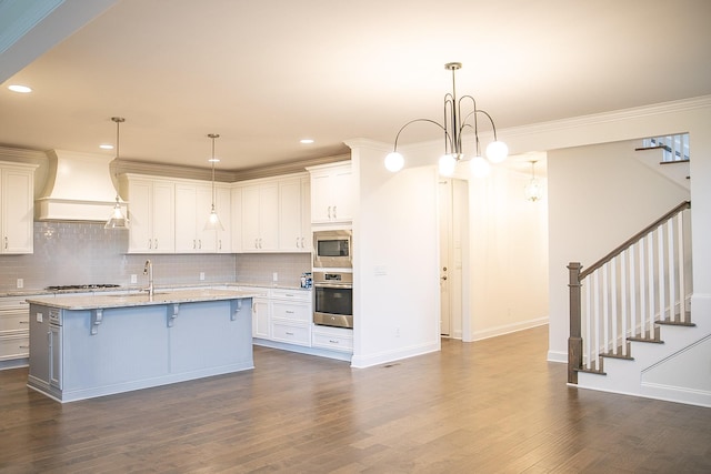 1023 Echelon Dr, Franklin, TN 37064 - kitchen with premium range hood, stainless steel appliances, a kitchen breakfast bar, dark wood-style flooring, and recessed lighting