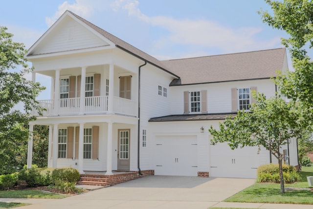 1023 Echelon Dr, Franklin, TN 37064 - greek revival inspired property with covered porch, a standing seam roof, a garage, concrete driveway, and a metal roof