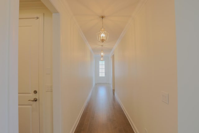 1023 Echelon Dr, Franklin, TN 37064 - corridor with ornamental molding, dark wood-type flooring, and a chandelier