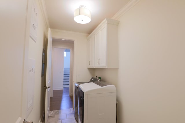 1023 Echelon Dr, Franklin, TN 37064 - washroom featuring washer and dryer, cabinet space, and crown molding