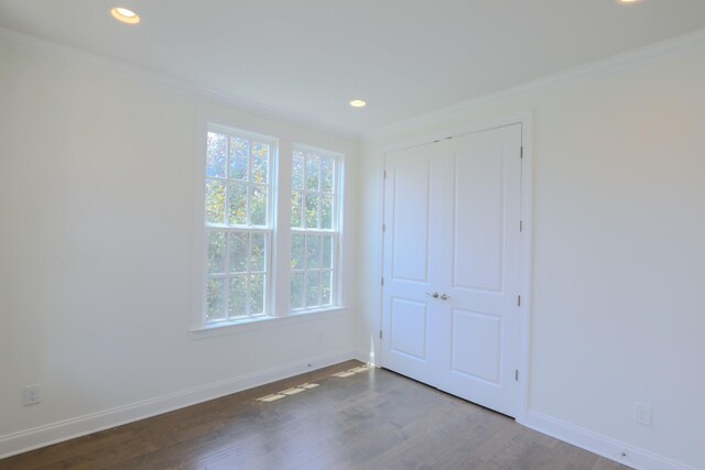 1023 Echelon Dr, Franklin, TN 37064 - unfurnished bedroom with crown molding, dark wood-type flooring, recessed lighting, and a closet