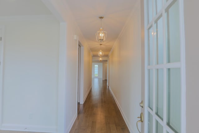 1023 Echelon Dr, Franklin, TN 37064 - hall featuring crown molding, a chandelier, and dark wood-type flooring