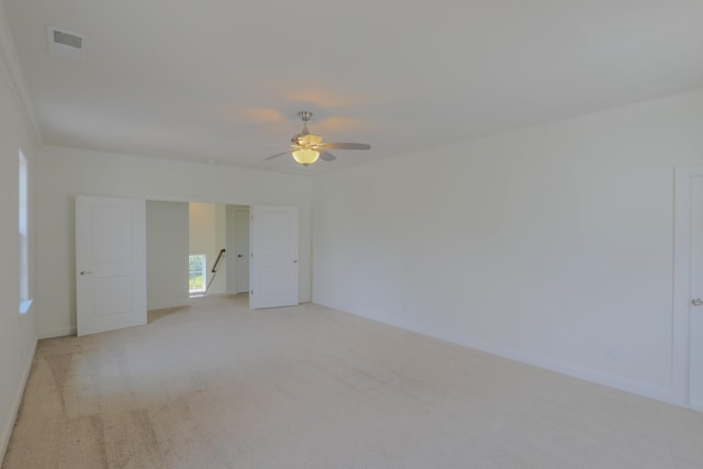 1023 Echelon Dr, Franklin, TN 37064 - empty room with a ceiling fan, light colored carpet, and ornamental molding
