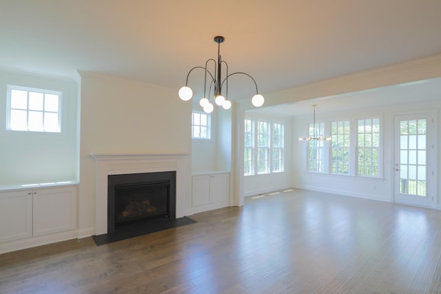 1023 Echelon Dr, Franklin, TN 37064 - unfurnished living room featuring a chandelier, a fireplace with flush hearth, wood finished floors, and ornamental molding