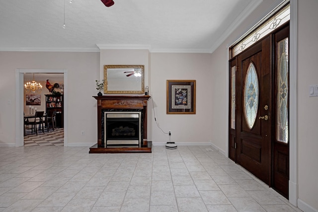 398 N Hummingbird Ln, Dickson, TN 37055 - foyer with a chandelier, crown molding, a fireplace with raised hearth, ceiling fan, and light tile patterned flooring
