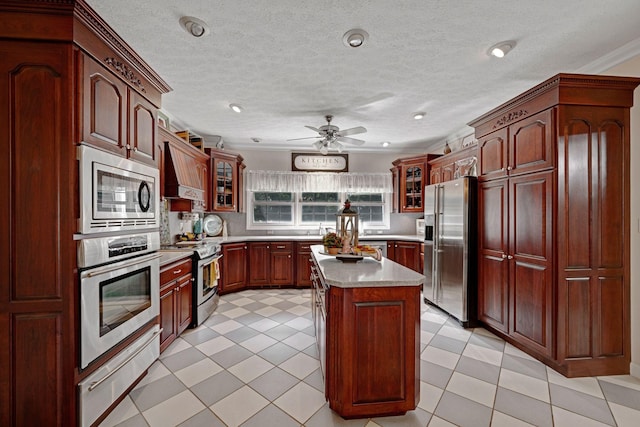 398 N Hummingbird Ln, Dickson, TN 37055 - kitchen featuring appliances with stainless steel finishes, light countertops, glass insert cabinets, backsplash, and a ceiling fan