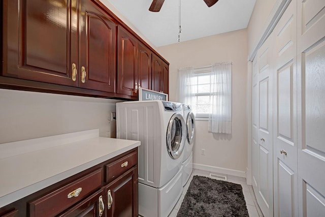 398 N Hummingbird Ln, Dickson, TN 37055 - laundry room with cabinet space, washing machine and dryer, a ceiling fan, and light tile patterned floors