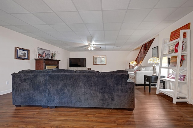 398 N Hummingbird Ln, Dickson, TN 37055 - living area featuring ceiling fan, dark wood-style flooring, and a paneled ceiling