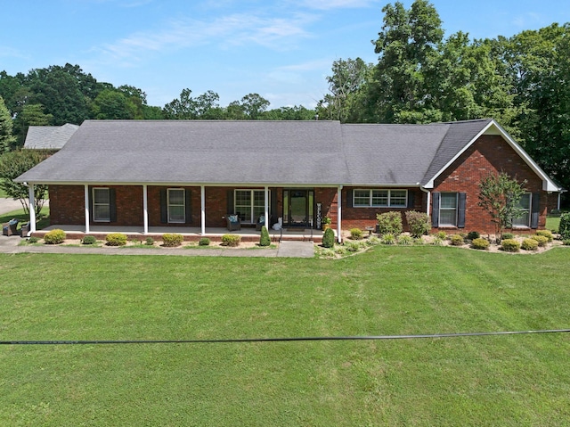 398 N Hummingbird Ln, Dickson, TN 37055 - ranch-style house with brick siding, a porch, and a front lawn