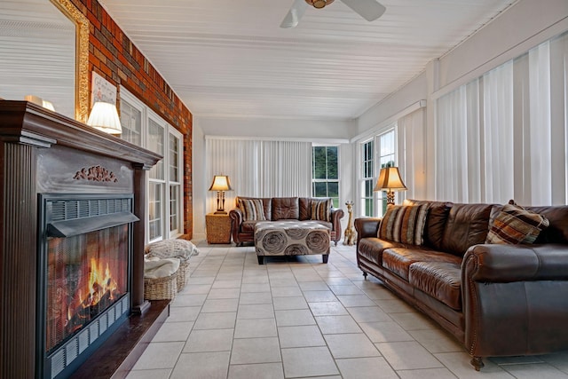 398 N Hummingbird Ln, Dickson, TN 37055 - living room featuring a warm lit fireplace, light tile patterned floors, and ceiling fan