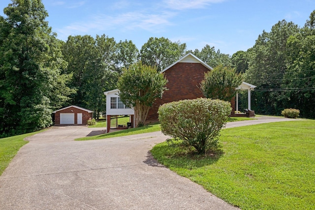 398 N Hummingbird Ln, Dickson, TN 37055 - view of front of house with an outdoor structure, a front lawn, and a garage