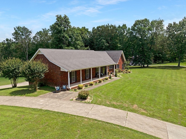 398 N Hummingbird Ln, Dickson, TN 37055 - ranch-style home featuring covered porch, brick siding, and a front lawn