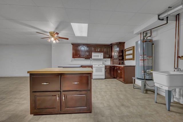 398 N Hummingbird Ln, Dickson, TN 37055 - kitchen with white appliances, gas water heater, ceiling fan, light countertops, and a kitchen island