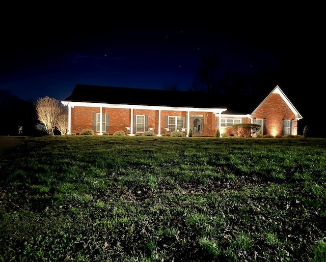 398 N Hummingbird Ln, Dickson, TN 37055 - ranch-style home featuring brick siding and a lawn