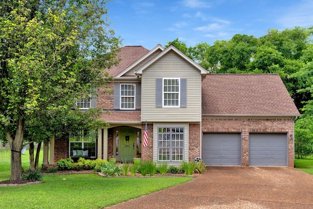 805 Tunewood Ct, Hermitage, TN 37076 - traditional-style home featuring brick siding, driveway, a front yard, roof with shingles, and a garage