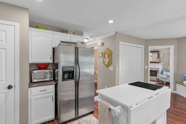 805 Tunewood Ct, Hermitage, TN 37076 - kitchen with stainless steel fridge with ice dispenser, white cabinets, dark wood-type flooring, a kitchen island, and recessed lighting