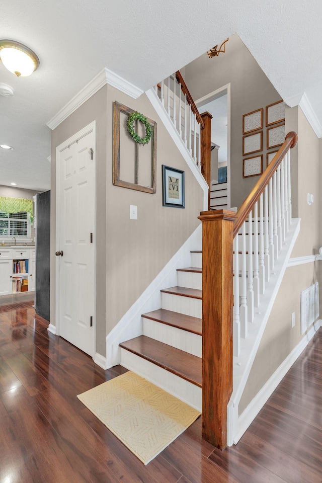 805 Tunewood Ct, Hermitage, TN 37076 - stairs featuring crown molding and wood finished floors