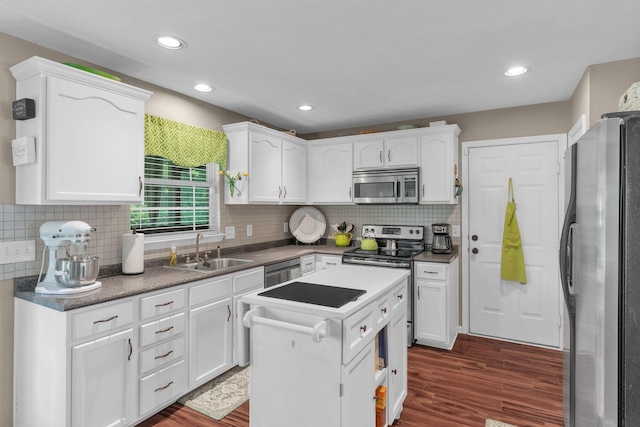 805 Tunewood Ct, Hermitage, TN 37076 - kitchen featuring stainless steel appliances, white cabinets, dark wood-style floors, tasteful backsplash, and recessed lighting