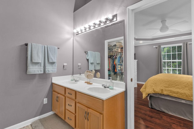 805 Tunewood Ct, Hermitage, TN 37076 - bathroom with double vanity, ceiling fan, wood finished floors, a spacious closet, and ornamental molding