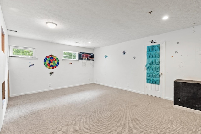 149 Cora St, Portland, TN 37148 - empty room with a textured ceiling, carpet flooring, and recessed lighting