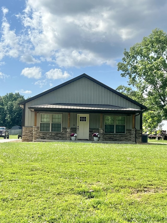 108 Chase Bend Rd, Estill Springs, TN 37330 - view of front of home with stone siding, a front yard, and board and batten siding