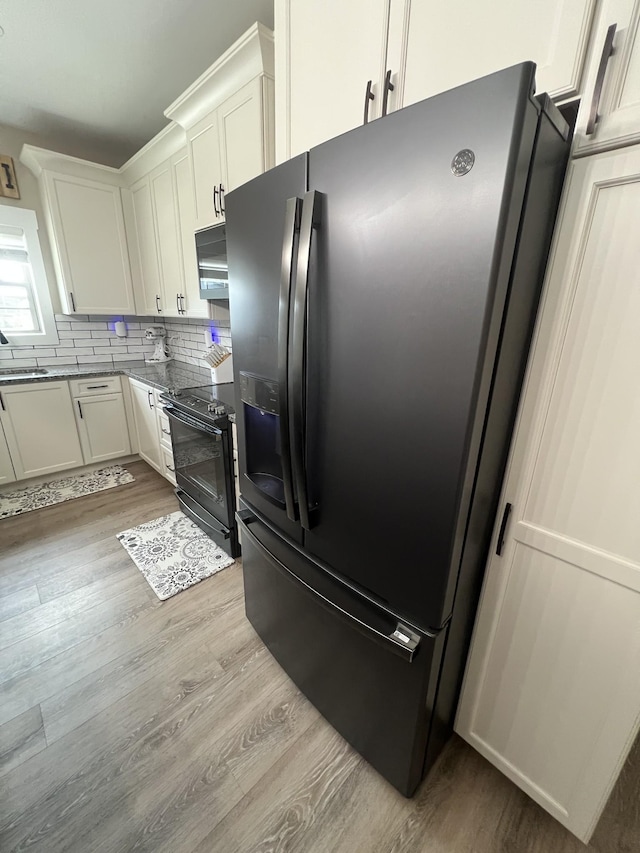 108 Chase Bend Rd, Estill Springs, TN 37330 - kitchen with fridge with ice dispenser, black electric range oven, light wood-style floors, and tasteful backsplash