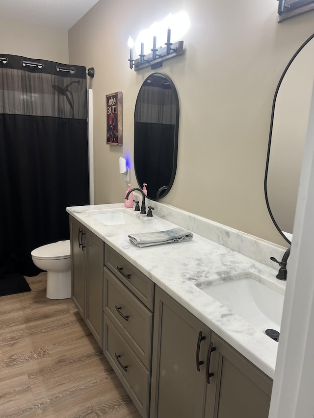 108 Chase Bend Rd, Estill Springs, TN 37330 - bathroom with double vanity, wood finished floors, and a shower with shower curtain
