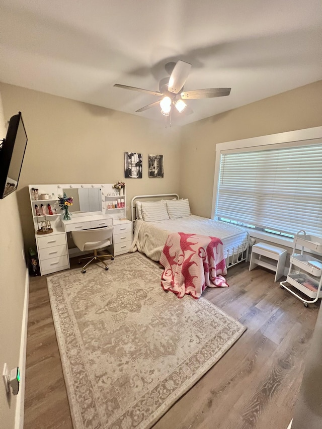 108 Chase Bend Rd, Estill Springs, TN 37330 - bedroom with wood finished floors, ceiling fan, and an office area