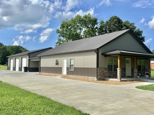 108 Chase Bend Rd, Estill Springs, TN 37330 - view of front of house with covered porch, a metal roof, stone siding, and a standing seam roof