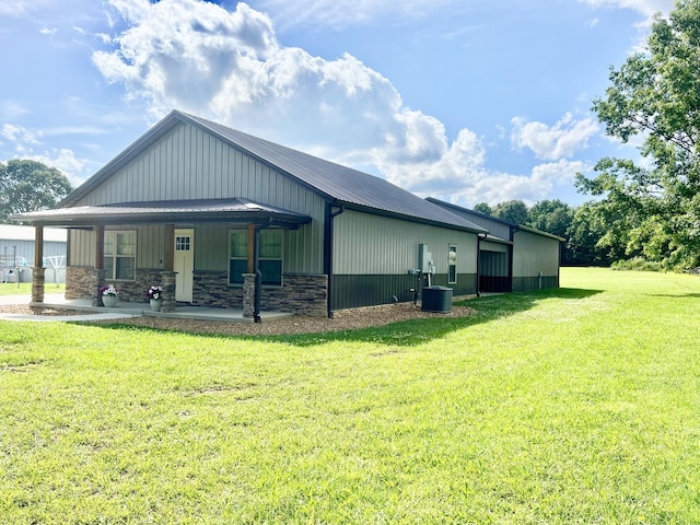 108 Chase Bend Rd, Estill Springs, TN 37330 - view of side of home with a yard, stone siding, a metal roof, and a porch