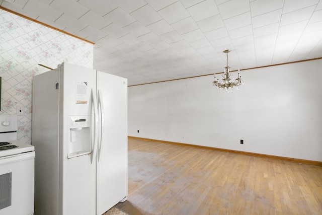 604 2nd Ave, Lawrenceburg, TN 38464 - kitchen with white appliances, wallpapered walls, a chandelier, light wood-type flooring, and crown molding
