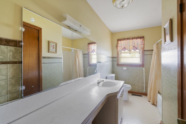 604 2nd Ave, Lawrenceburg, TN 38464 - full bathroom featuring tile walls, wainscoting, vanity, and shower / bath combo with shower curtain