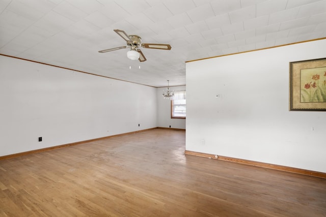 604 2nd Ave, Lawrenceburg, TN 38464 - unfurnished room with ceiling fan, a chandelier, and light wood-type flooring